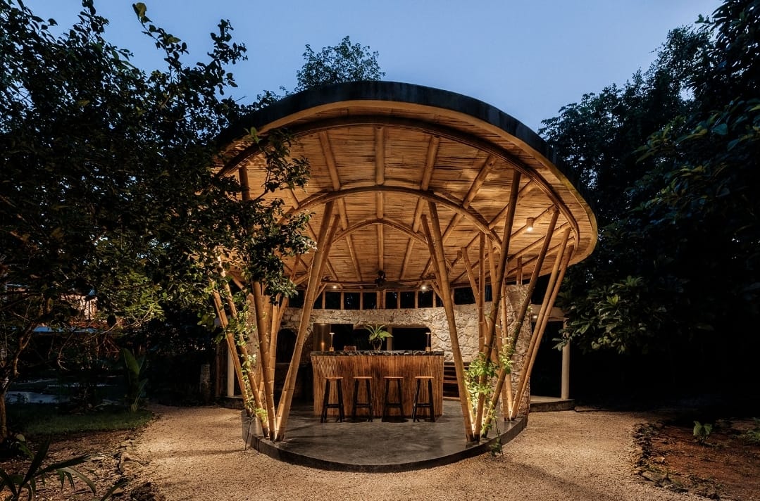 Open bamboo bar and kitchen pavilion at the Awakening Sanctuary at dusk